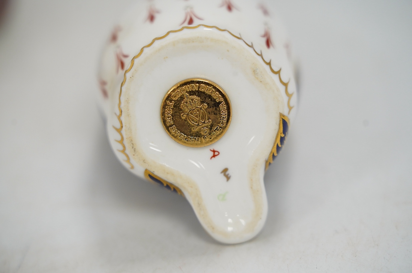 Eight Royal Crown Derby porcelain paperweights in the form of animals including a penguin, rabbit and seal, largest 17cm wide. Condition - seven good, one broken